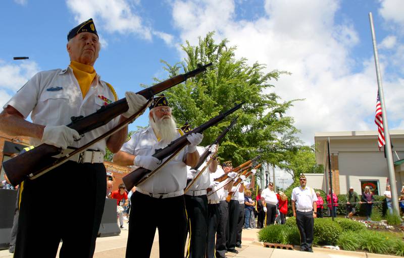 Members of Huntley American Legion Post 673 offer a rifle salute as part of the Huntley Memorial Day observance Monday.