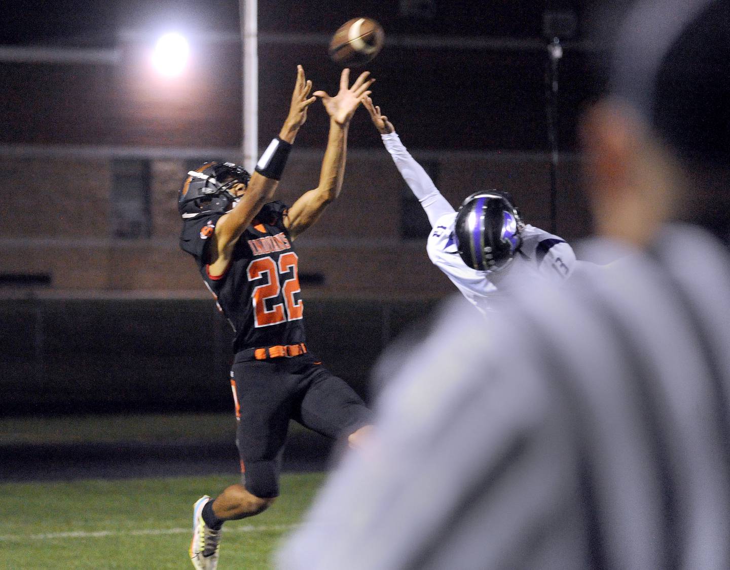 Sandwich wide receiver Calvin Lane, Jr. (22) catches a touchdown pass against Plano defender Amari Bryant (13) during a varsity football game at Sandwich High School on Friday, Sept. 8, 2023.