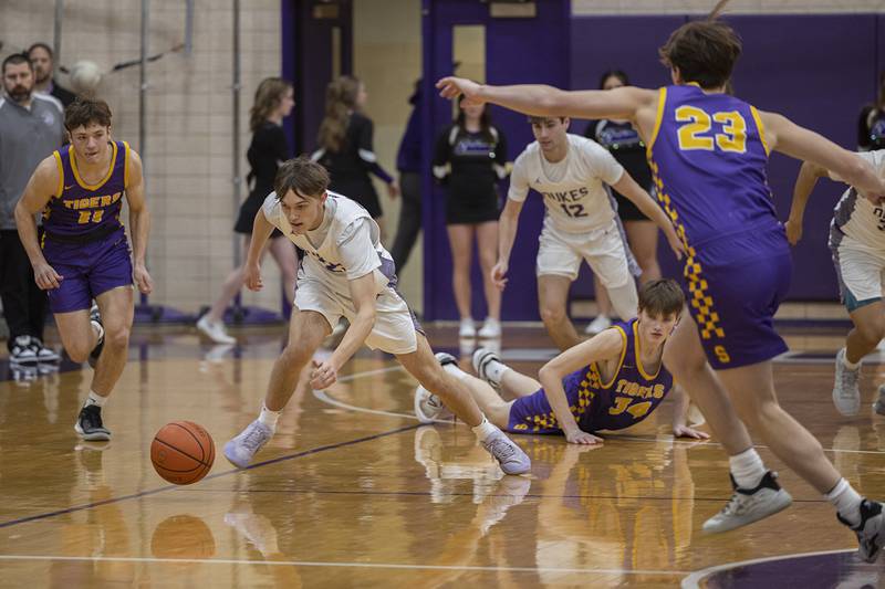 Dixon’s Bryce Feit chases after a loose ball against Sherrard Thursday, Feb. 15, 2024 at Dixon High School.