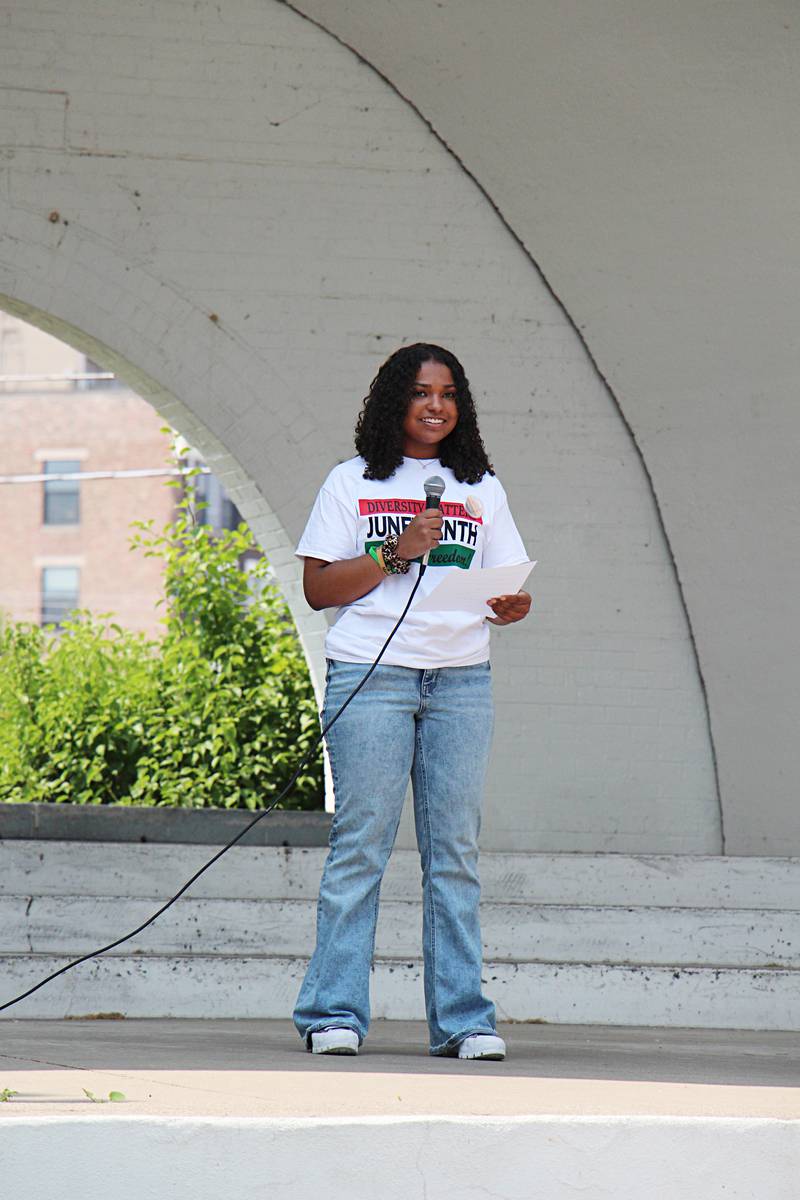 Angelina Washington, 15, reads a poem Saturday, June 17, 2023 at a Sterling Juneteenth celebration.