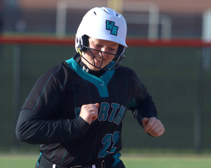 Woodstock North’s Jo Jo Vermett rounds the bases on a home run in varsity softball at Crystal Lake Central Friday.