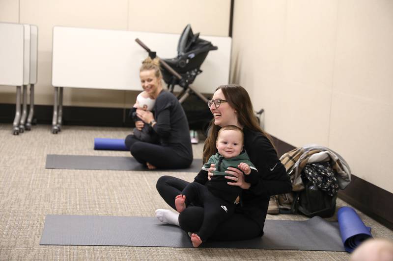 Alex Heintz of St. Charles and her son, Calvin, 7 months, and Danielle Slavinskas of St. Charles and her son, Milo, 6 months, participate in a baby yoga class at Northwestern Medicine Delnor Hospital in Geneva.