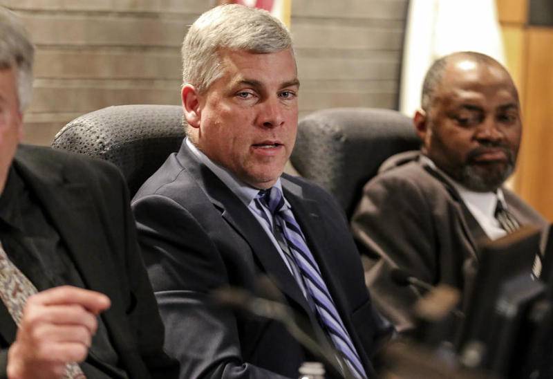 Mayor Bob O'Dekirk speaks to Joliet Park District Executive Director Tom Carstens on Tuesday during the Joliet City Council meeting in Joliet. O'Dekirk said he wants the city to take a new look at the local homeless issue in the aftermath of the fatal stabbing of a Harrah's Casino hotel guest last month.