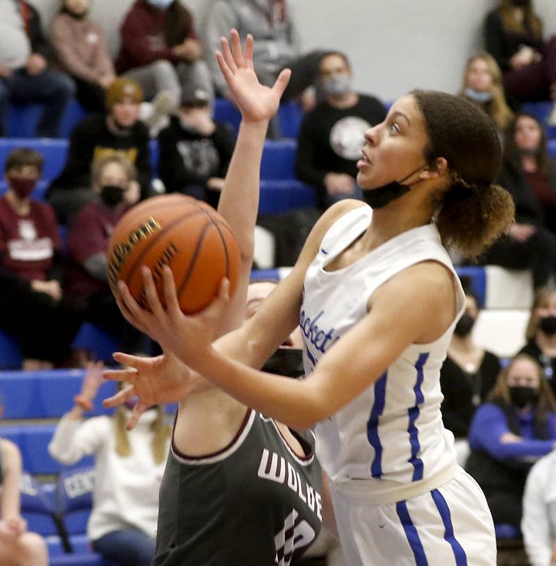 Burlington Central's Taylor Charles drives to the basket while being defended by Prairie Ridge's Elani Nanos during Fox Valley Conference girls basketball game Monday evening, Jan. 31 2022, between Prairie Ridge and Burlington Central at Burlington Central High School.