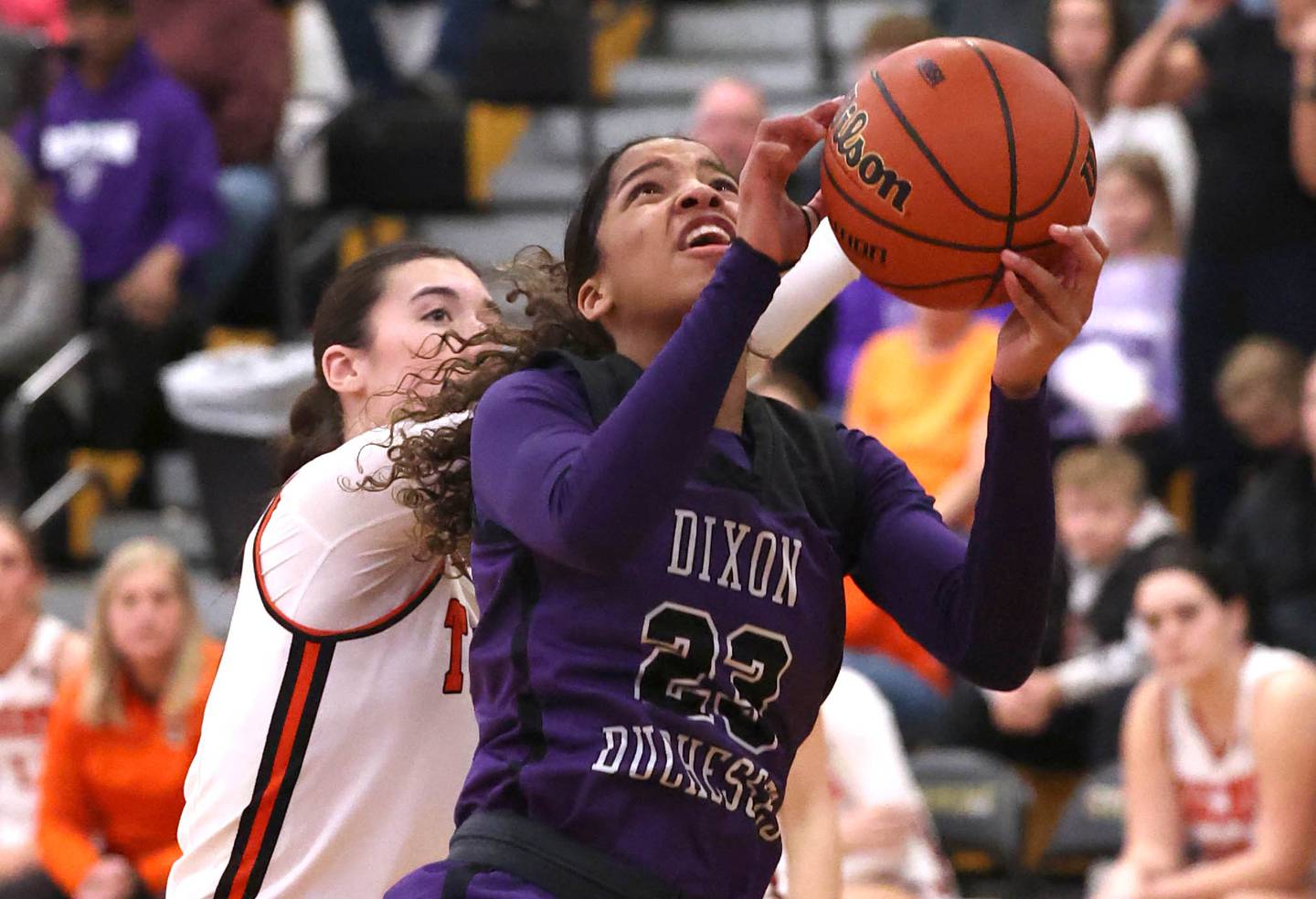 Dixon’s Ahmyrie McGowan gets up a shot in front of Crystal Lake Central's Quin O'Donnell during their Class 3A sectional semifinal Tuesday, Feb. 20, 2024, at Sycamore High School.