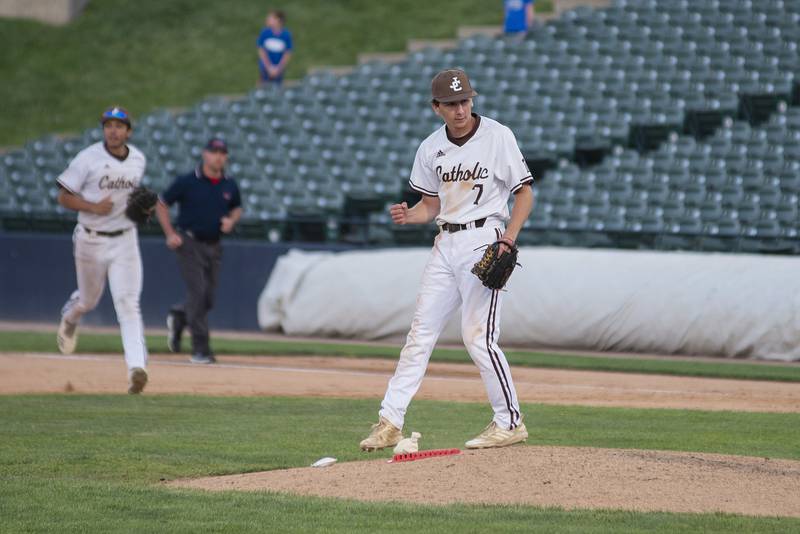 Joliet Catholic’s Dom Coda celebrates after striking out the side to end the game against Columbia Friday, June 3, 2022 during the IHSA Class 2A baseball state semifinal.