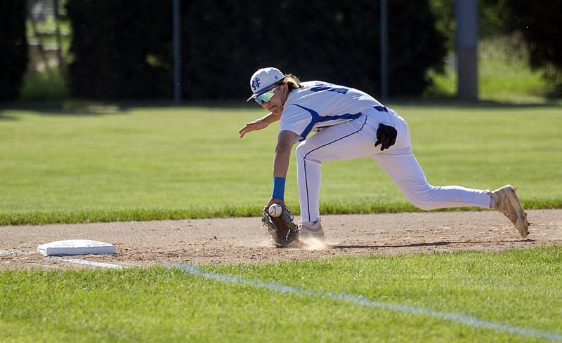 Newman’s Garet Wolfe backhands a grounder at third base against Stillman Valley Wednesday, May 22, 2024 in the Class 2A sectional semifinal in Byron.