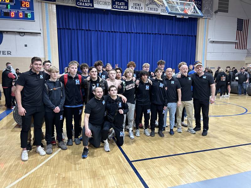 Marian Central poses after beating Byron 48-28 in Tuesday's Class 1A Newman Central Dual Team Sectional in Sterling.