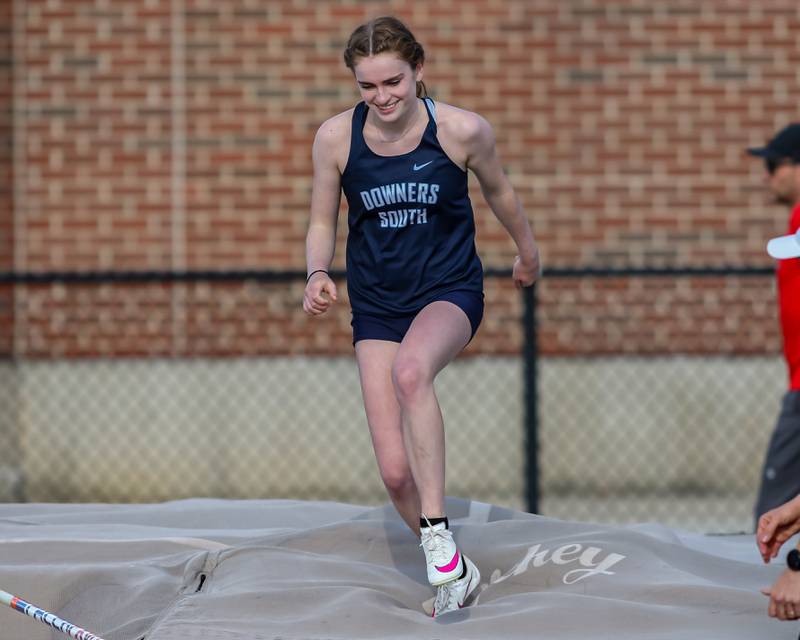 Downers Grove South's Kailee Rodeck reacts after clearing the bar in the pole vault at Friday's Class 3A Downers Grove North girls track and field meet.