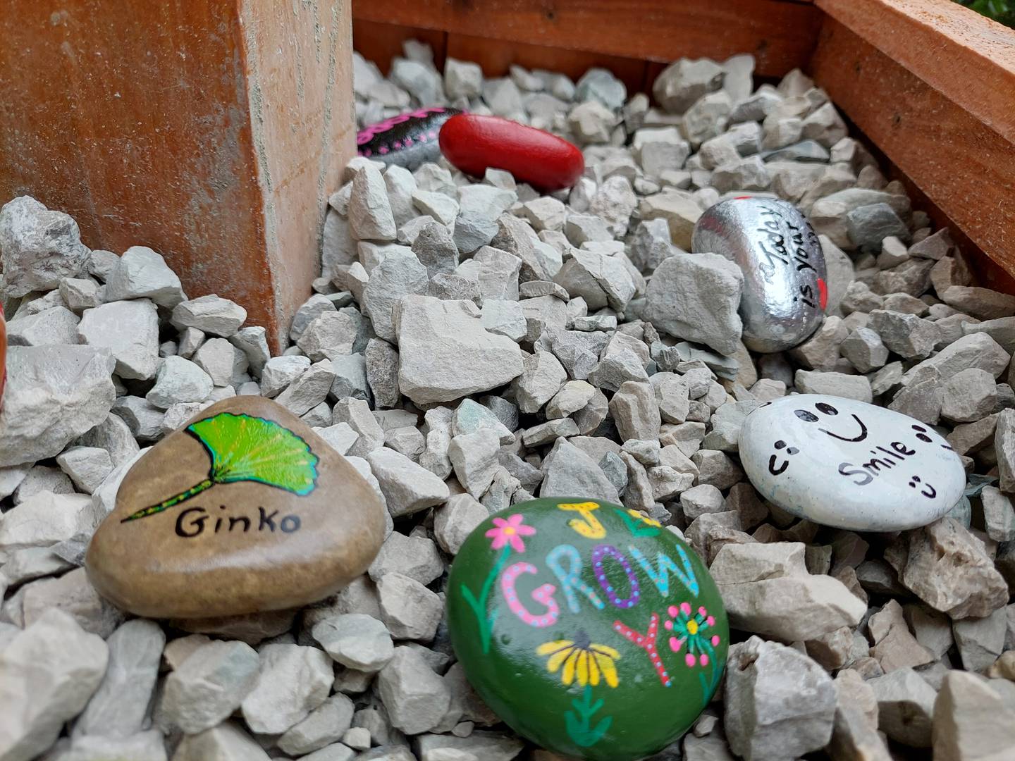 In addition to the Free Little Art Gallery, a rock garden has been installed at the base of the gallery where anyone can take and or leave painted rocks. Rocks often feature uplifting messages and can be found randomly placed or "hidden" around town.
