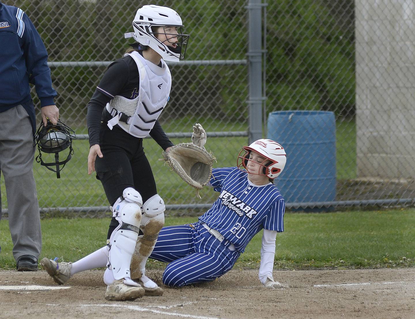 Newark’s Kodi Rizzo slides into home safely as Serena”s RayElle Brennan waits on the throw in the 1st inning on Monday, May 1, 2023 at Serena High School.