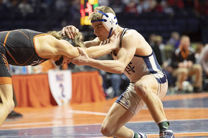 Sterling Newman Central’s Brady Grennan (right) works against Richland’s Carson Bissey in the 132 pound 1A third place match Saturday, Feb. 17, 2024 at the IHSA state wrestling finals at the State Farm Center in Champaign.