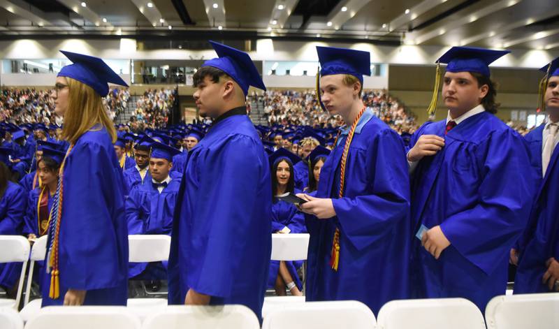 Joe Lewnard/jlewnard@dailyherald.com
Graduates line up to receive their diplomas during the Wheaton North High School graduation, held at the College of DuPage in Glen Ellyn Saturday.