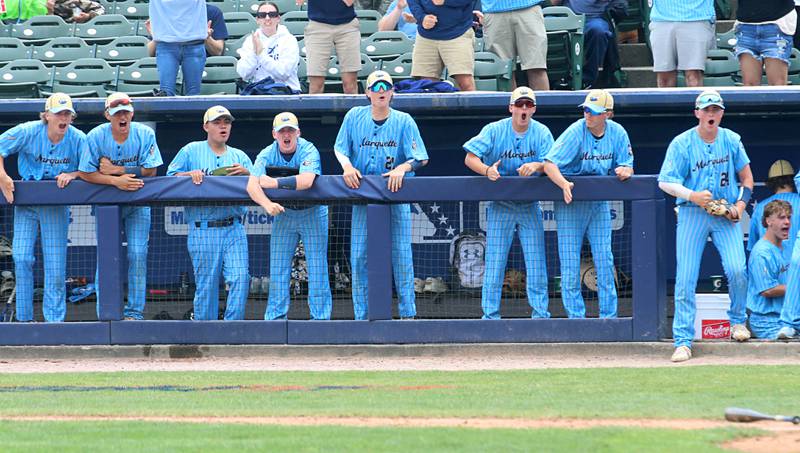 Members of the Marquette baseball team react after scoring the first run against Altamont during the Class 1A State championship game on Saturday, June 1, 2024 at Dozer Park in Peoria.