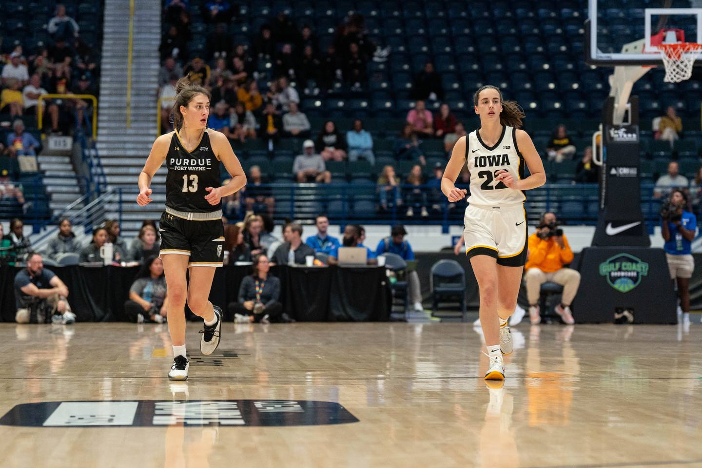 Mendota graduate and Purdue-Fort Wayne guard Amellia Bromenschenkel (13) runs down the court alongside Iowa's Caitlin Clark during a game in the Gulf Coast Showcase on Nov. 24 in Florida. Bromenschenkel had 16 points and six rebounds in the 98-59 loss, while Clark scored 29 points.