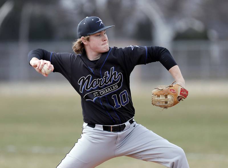 St. Charles North's Cole Schertz (10) delivers a pitch Tuesday March 28, 2023 in Mt. Prospect.