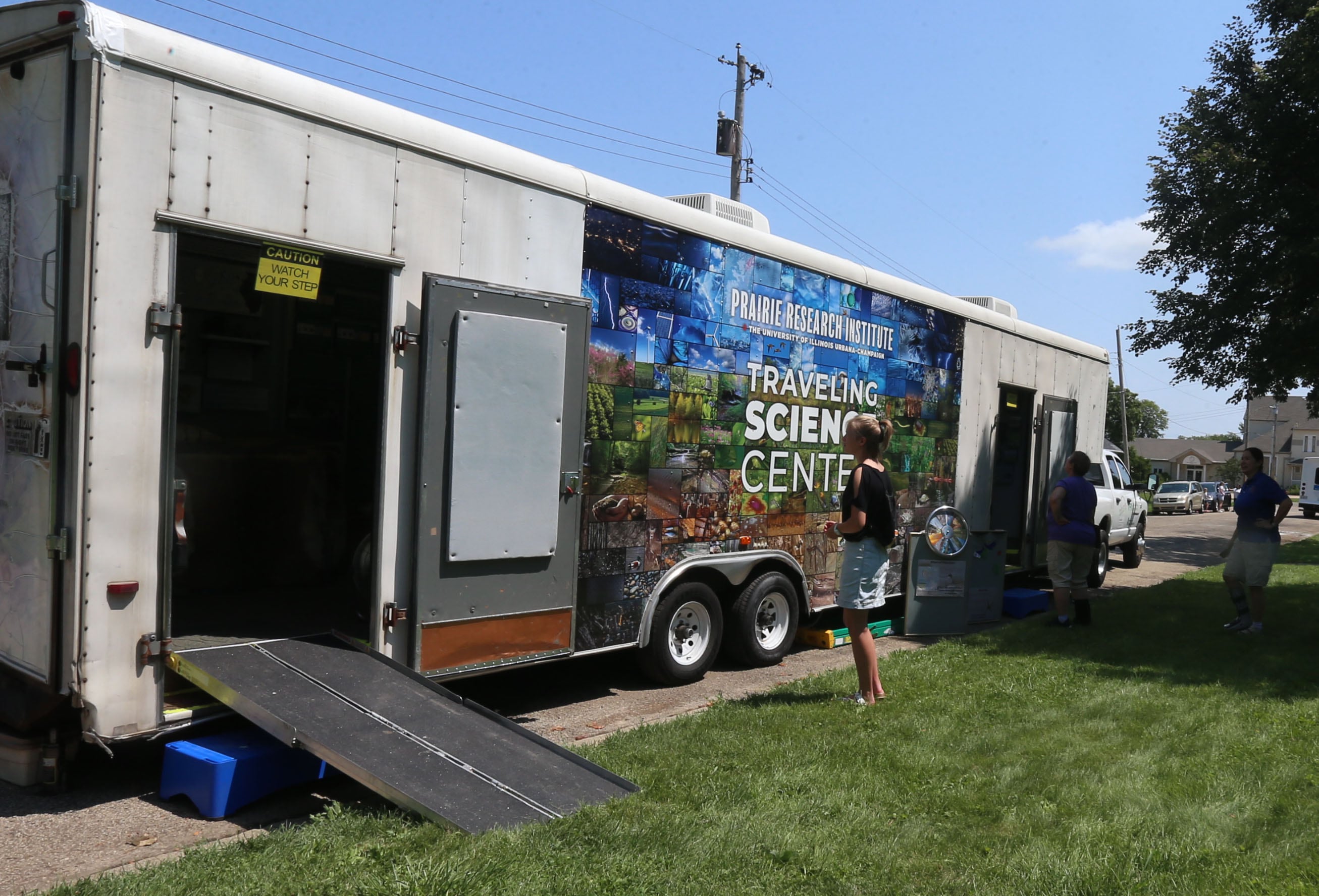 The Illinois Natural History Survey Traveling Science Center  made a stop at Hopkins Park on Tuesday, July 30, 2024  in Granville.
The Illinois Natural History Survey Traveling Science Center is a 320-square-foot mobile classroom featuring informative, engaging exhibits on biodiversity and natural resources that visits schools and communities across Illinois.
Visitors learn about the types of habitats and species diversity of their region, as well as ways to protect against threats to that diversity.
Since 2006, the center has visited more than 150 communities and 200 public events while providing structured school programs for up to 30,000 students each year. Sponsors are North Central Bank, Granville National Bank, Boggios Orchard & Produce and Financial Plus Credit Union.