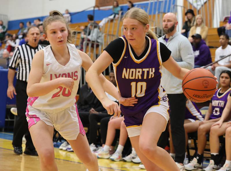 Downers Grove North’s Hope Sebek (10) drives the ball against Lyons Township during the girls varsity basketball game on Tuesday, Jan. 16, 2024 in La Grange, IL.