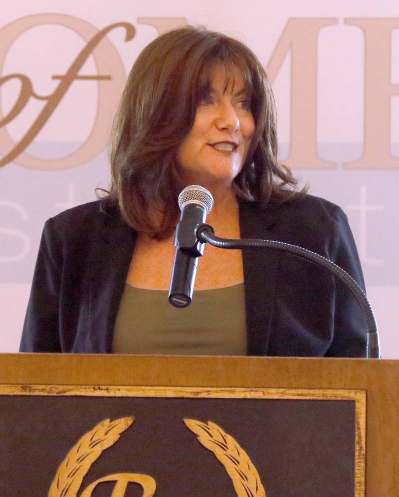 Award recipient Dawn Bremer speaks during the Northwest Herald's Women of Distinction award luncheon Wednesday June 5, 2024, at Boulder Ridge Country Club, in Lake in the Hills. The luncheon recognized 11 women in the community as Women of Distinction.