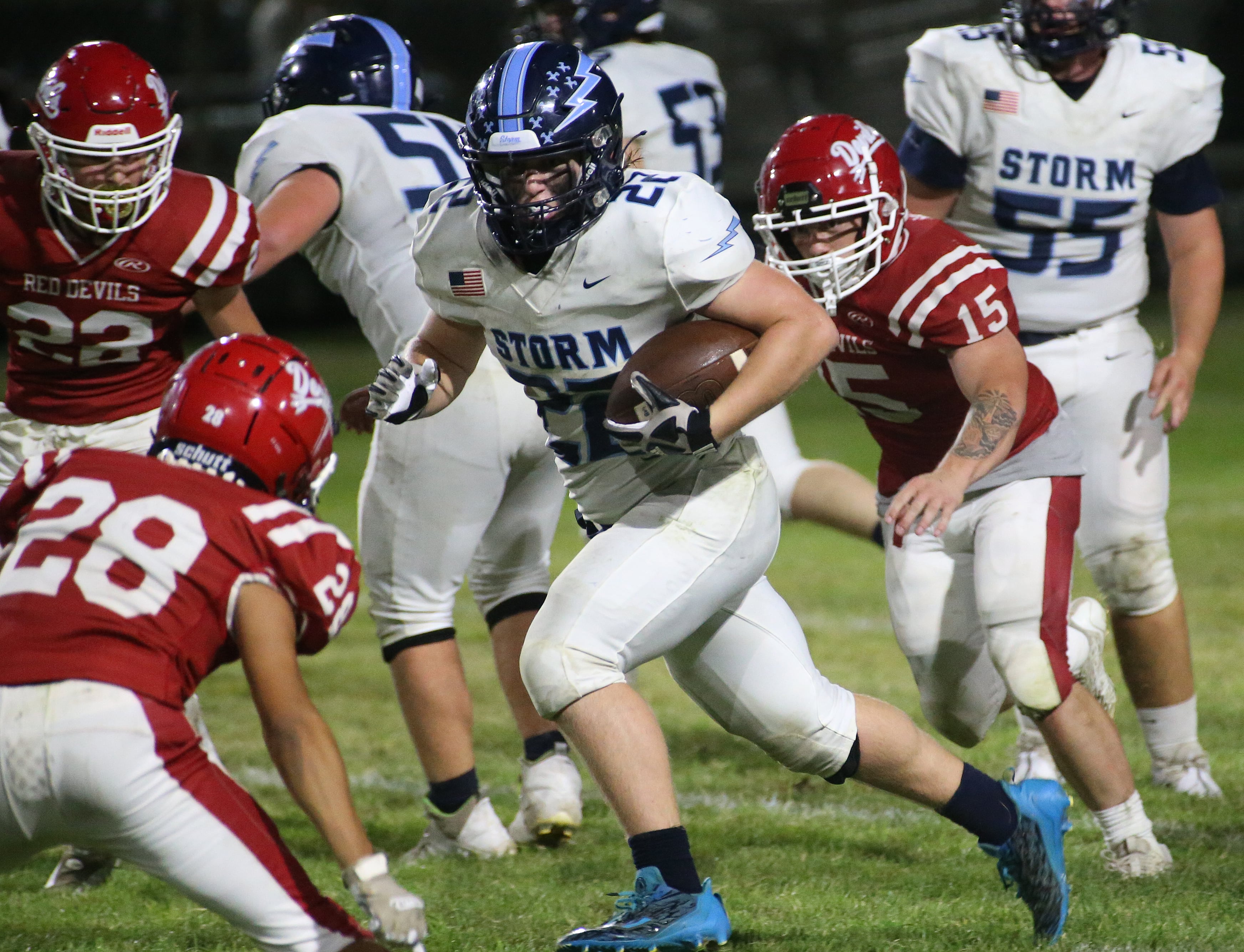 Bureau Valley's Elijah Endress runs the ball between Hall defenders Jack Curran, Deanthony Weatherspoon and Tristan Redcliff on Friday, Sept 8, 2023 at Richard Nesti Stadium.