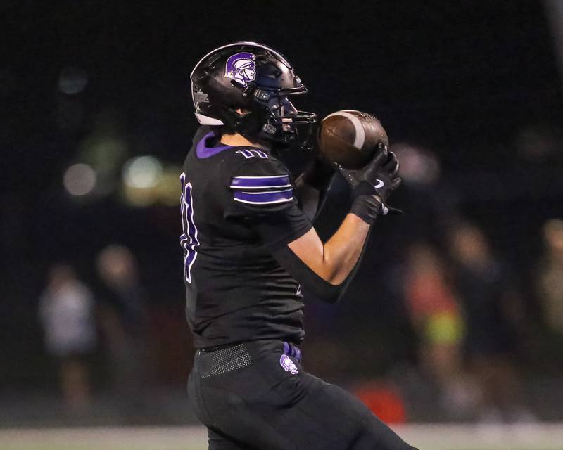 Downers Grove North's Charlie Cruse (11) comes down with a catch before running it into the endzone during a football game between Glenbard West at Downers Grove North on Friday, Sept 13th, 2024  in Downers Grove.