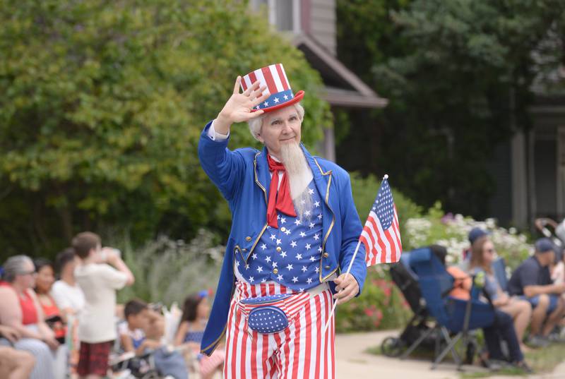 Gregg Steingmeyer of Chicago dresses as Uncle Sam while participating in the Downers Grove Fourth of July Parade on Thursday, July 4, 2024.