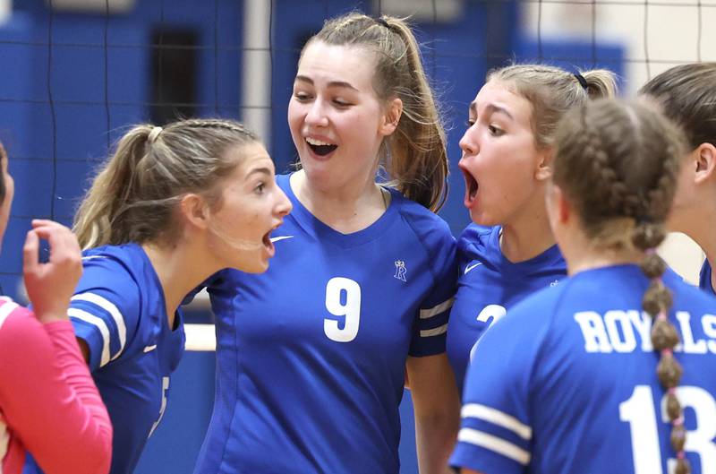 Rosary players celebrate a point during their Regional semifinal match against Genoa-Kingston Tuesday, Oct. 25, 2022, at Rosary High School in Aurora