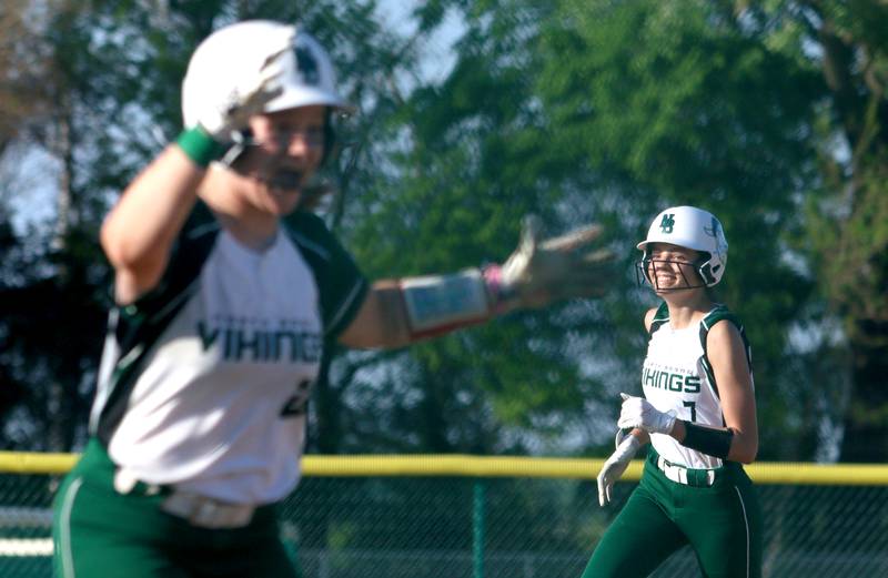 North Boone’s Avarie Torres, right, is all smiles rounding the bases after belting a grand slam in IHSA Softball Class 2A Regional Championship action at Marengo Friday.