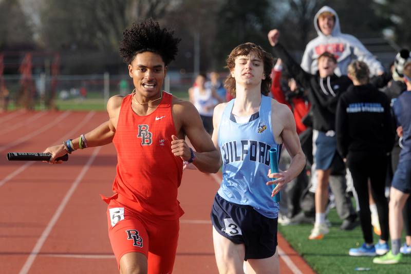 Much to the joy of his teammates, Bradley Bourbonnais's Deon Jackson crosses the finish just ahead of Rockford Guilford's Jaidyn Nguyen during the Matt Wulf Track and Field Invitational at Yorkville High School on Friday, April 12, 2024.