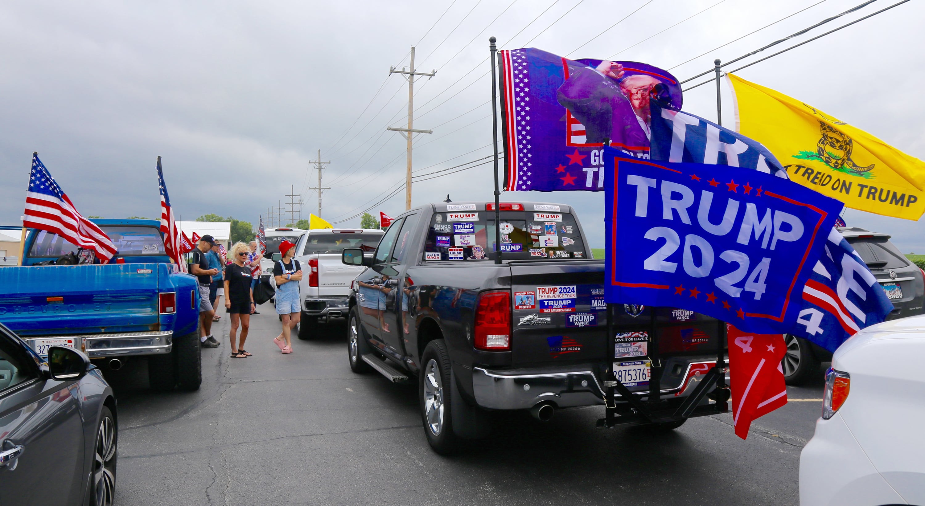 Supporters of President Trump gather on Sunday, Aug. 18, 2024 in Lily Lake before participating in a caravan to a rally in Woodstock.