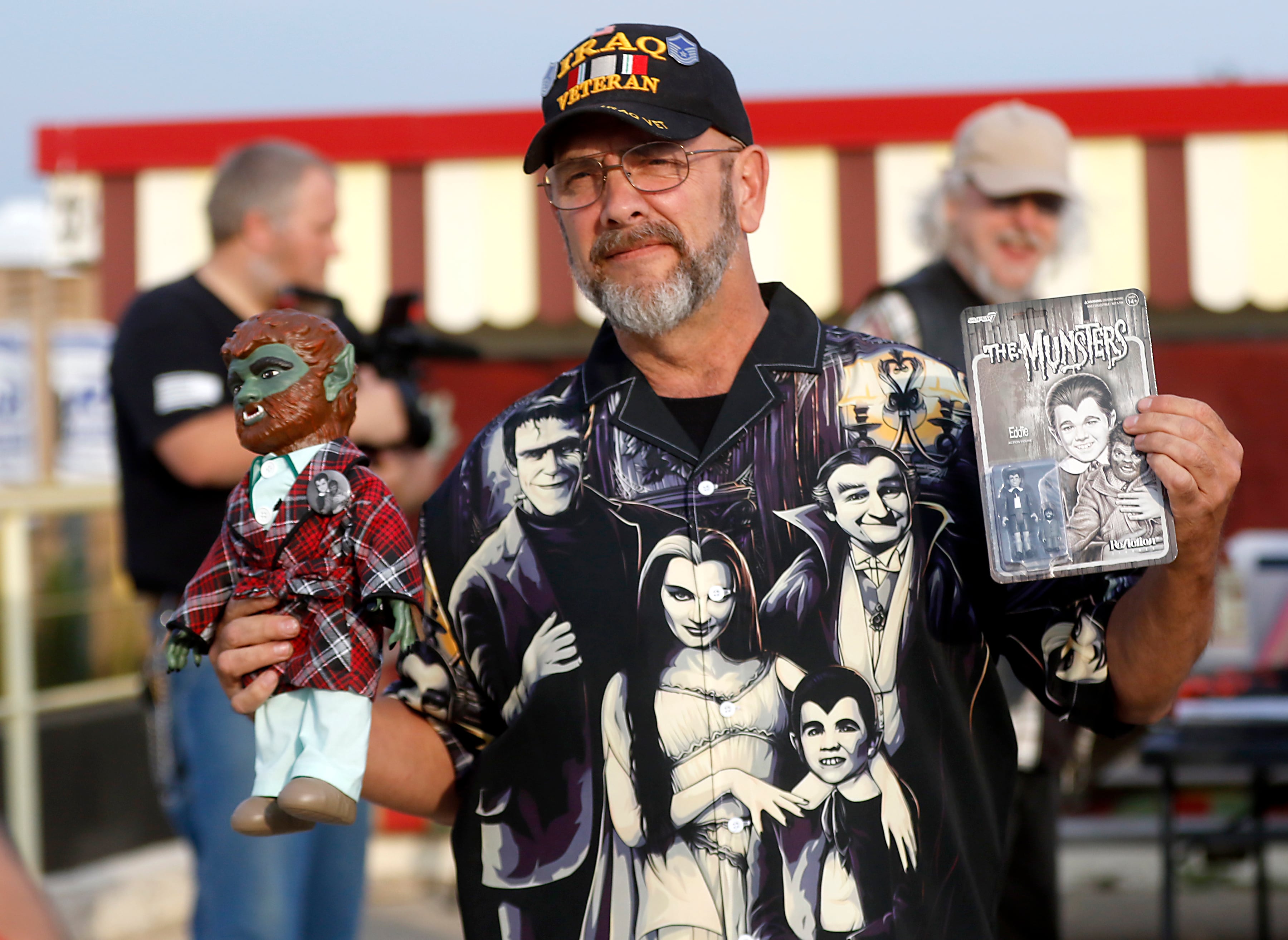 Bob Leisle shows off items that he is going to have Butch Patrick, who played Eddie Munster on the 1960s show “The Munsters” after Patrick sign on Wednesday,  Aug. 14, 2024, during an appearance at the McHenry Outdoor Theater.