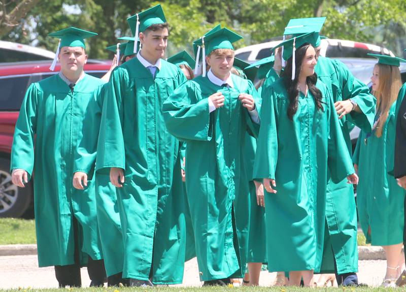 Graduates walk in procession to the Abbey Church for the commencement ceremony on Sunday, May 19, 2024 at St. Bede Academy.