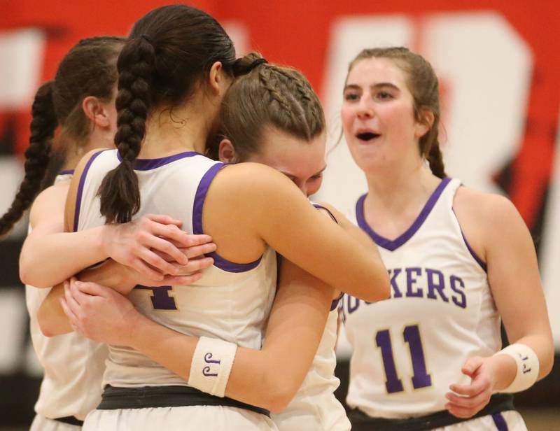 Serena's Jenna Setchell hugs Paisley Twait as teammate Rayelle Brennan looks on after winning the Class 1A Regional final over Ashton-Franklin Center on Thursday, Feb. 15, 2024 at Earlville High School.