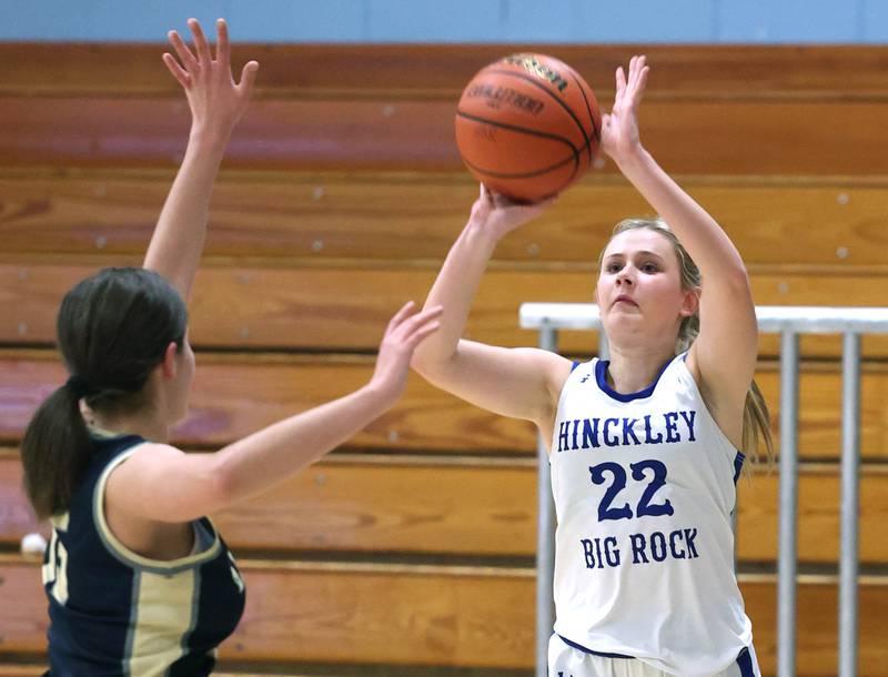 Hinckley-Big Rock’s Anna Herrmann shoots a three pointer over a Harvest Christian defender Monday, Jan. 8, 2023, during their game at Hinckley-Big Rock High School.