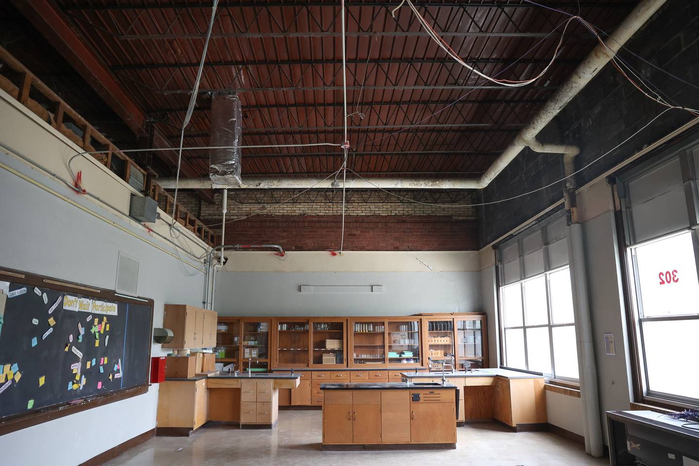 The roof in the 1952 section of Lockport Township High School Central Campus is visible in the chemistry classroom after crews took down the ceiling in the 1952 addition.