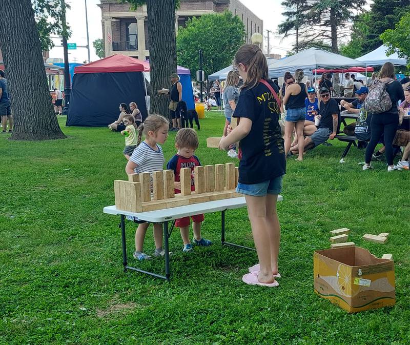 Families took part in yard games Saturday, May 18, 2024, at the Streator Food Truck Festival in City Park.