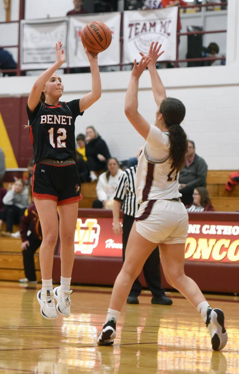 Benet AcademyÕs Lindsay Harzich, left, shoots a jump shot in front of MontiniÕs Alyssa Epps during the semifinal of the Montini girls basketball tournament Thursday December 28, 2023 in Lombard.