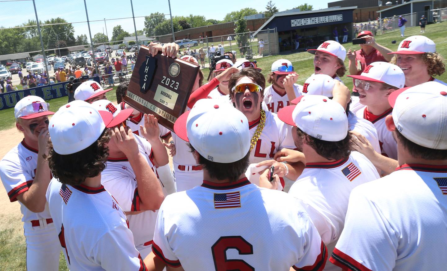 Members of the Hall baseball team celebrate after defeating Sherrard during the Class 2A Sectional final game on Saturday, May 27, 2023 at Knoxville High School.