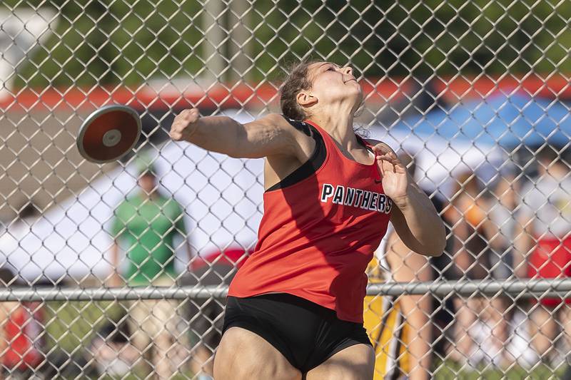 Erie’s Briana Neumiller fires off the discus Wednesday, May 10, 2023 at the class 1A Erie girls track sectional.