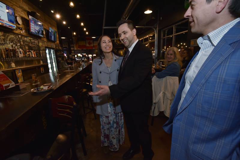 Jerry Evans and his wife Lisa react to a results update that showed him 2,400 votes ahead of the nearest challenger at his election watch party at Global Brew Tap House in St. Charles on Tuesday night, March 19, 2024.