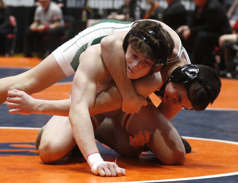 Coal City's Brock Finch tries to control Marian Central's Josh Gawronski during the 144-pound match in the IHSA Class 1A Dual Team Sate Championship match Saturday, Feb. 24, 2024 at Grossinger Motors Arena in Bloomington.