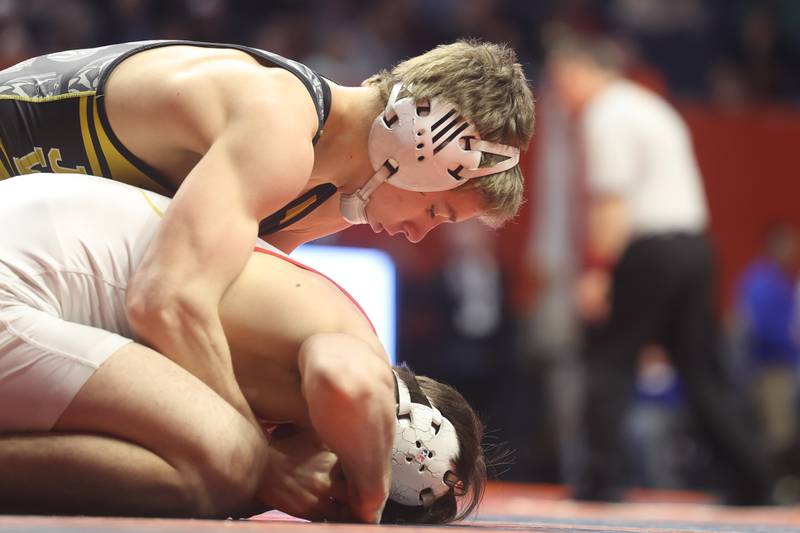 Joliet West’s Carson Weber works over Batavia’s Aidan Huck in the 144-pound Class 3A state 3rd place match on Saturday, Feb. 17th, 2024 in Champaign.