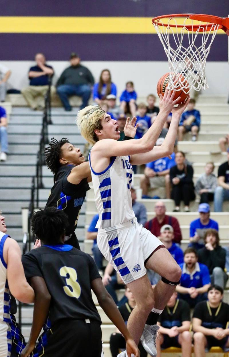 Princeton's Noah LaPorte drives for a first-half basket against Rockford Christian in Tuesday's Class 2A regional semifinal at Mendota. The Tigers won 69-66 to advance to Friday's championship game.