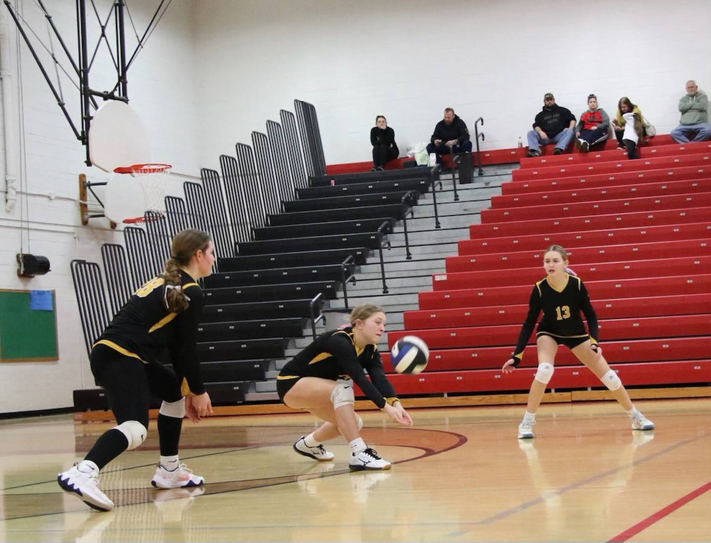 Eden Carlson digs up a serve for the PCJH 8th grade Pumas in Saturday's Marseilles Tournament.