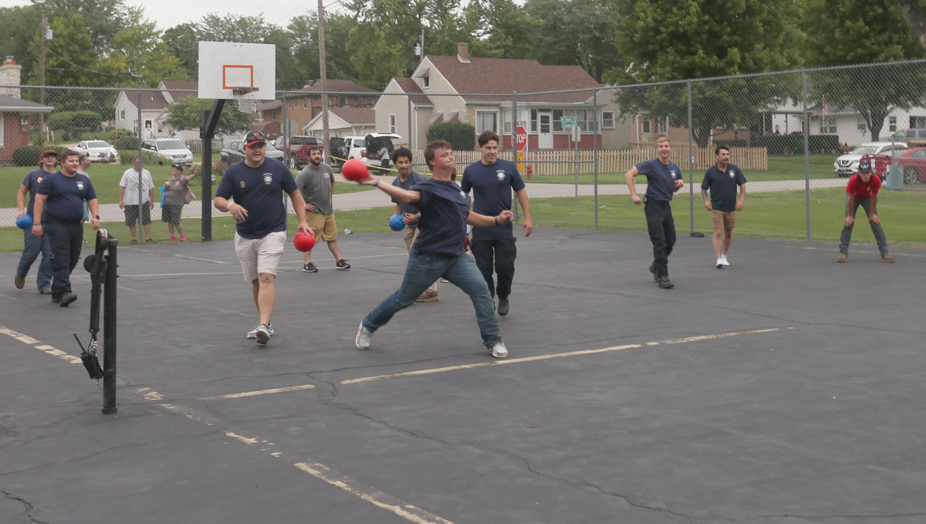 Spring Valley firefighters play dodgeball against kids during  the National Night Out event on Tuesday, Aug. 6, 2024 at Kirby Park in Spring Valley.