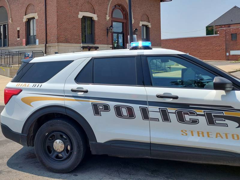 Streator police closed a block of Hickory Street near the Streator Post Office on Saturday, June 17, 2023, while bomb technicians removed a suspicious tote in the parking lot.