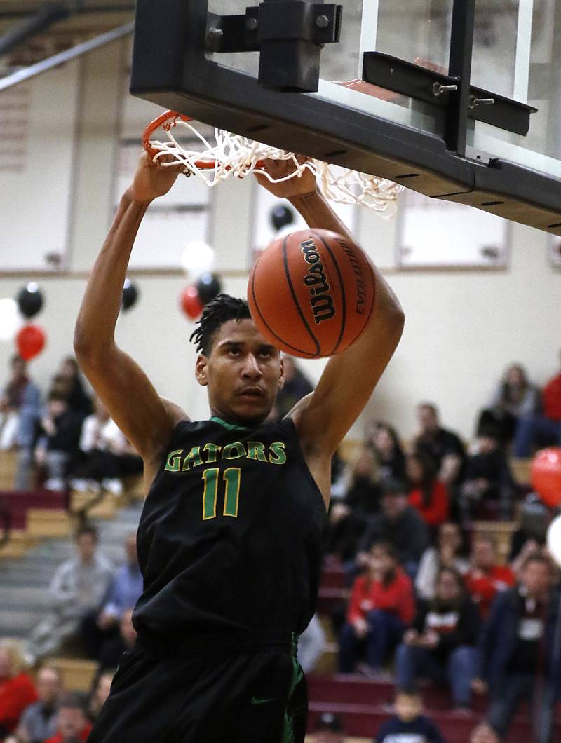 Crystal Lake South's Christian Rohde ducks the ball during a Fox Valley Conference boys basketball game against Huntley on Tuesday, Feb.6, 2024, at Huntley High School.