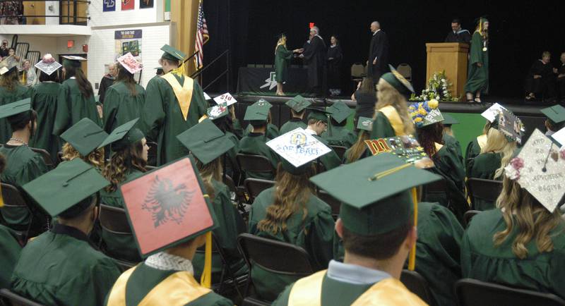 Rock Falls High School graduates line up to get their diplomas Sunday, May 26, 2024, during graduation at Rock Falls High School.