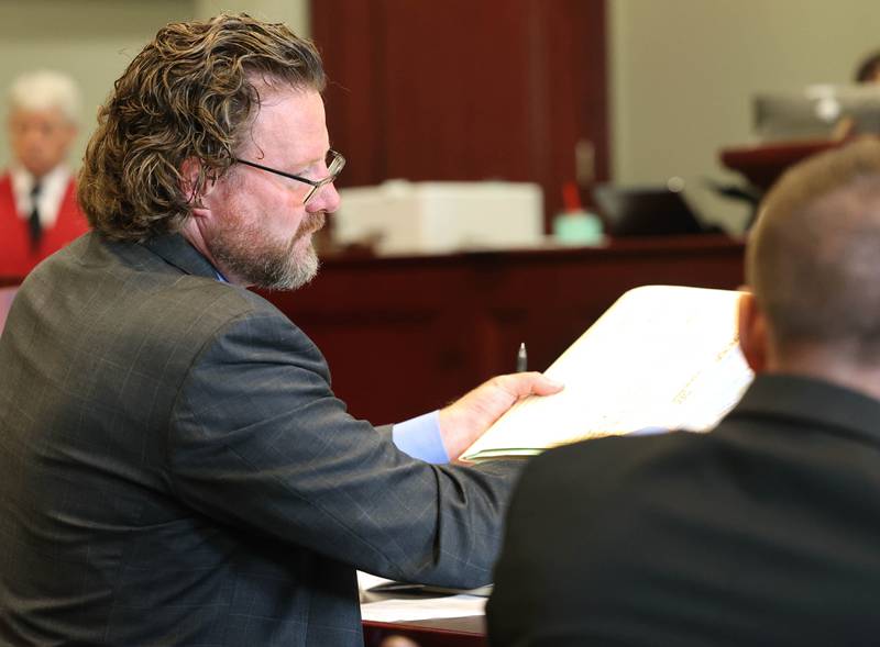 Scott Schwertley, DeKalb County assistant states attorney looks at some paperwork during the arraignment of Timothy M. Doll, 29, of DeKalb, Wednesday, June 14, 2023, at the DeKalb County Courthouse in Sycamore. Doll was being arraigned on several charges including two counts of first-degree murder in the death of 15-year-old Gracie Sasso-Cleveland of DeKalb.