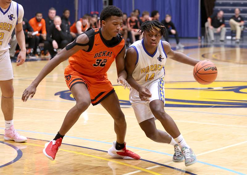 Warren's Javerion Banks dribbles around DeKalb’s Justin O’Neal Tuesday, Feb. 27, 2024, during their Class 4A sectional semifinal game at Rock Valley College in Rockford.